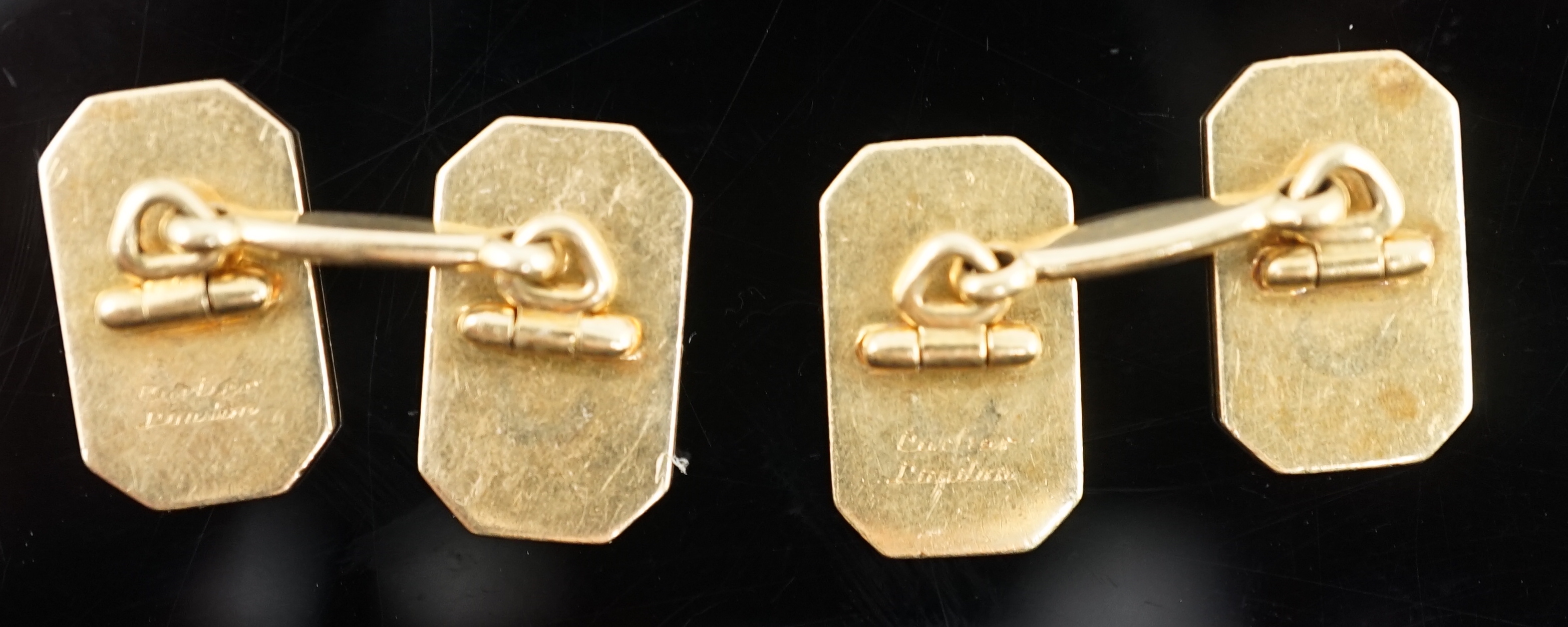 A pair of 1920's/1930's Cartier gold and two colour enamel rectangular Regimental cufflinks, with canted corners